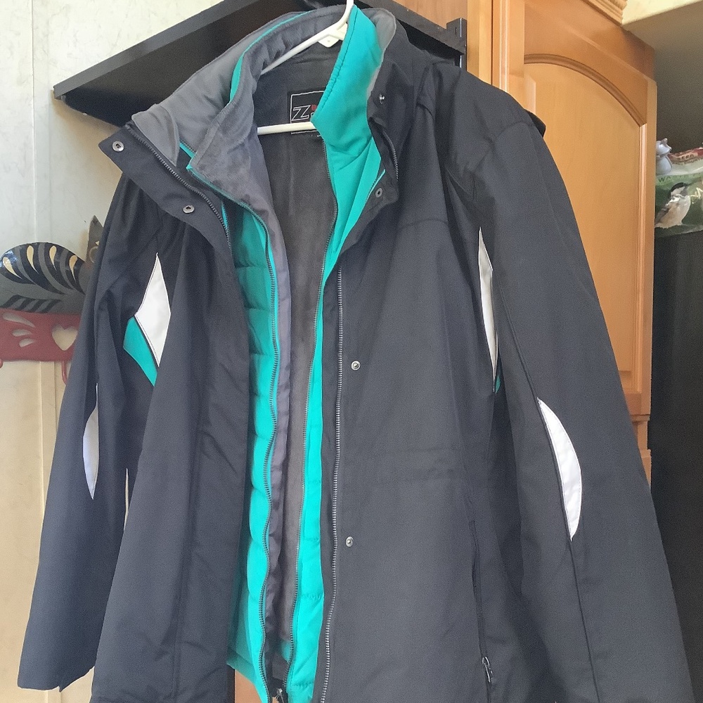 Lady’s black and turquoise winter jacket with lining